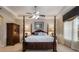 Large main bedroom with a post bed, ceiling fan, and ample natural light at 268 Heatherbrooke Cir, Oviedo, FL 32765