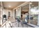 Screened porch with small table and chairs, kitchen view at 268 Heatherbrooke Cir, Oviedo, FL 32765