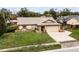 Single-story house with a large yard and driveway at 2700 Dorado Ct, Apopka, FL 32703