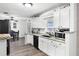 Bright kitchen with granite countertops and white cabinets at 2700 Dorado Ct, Apopka, FL 32703