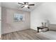 Cozy living room featuring a gray sectional sofa and wood-look floors at 2700 Dorado Ct, Apopka, FL 32703