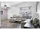 Relaxing living room, gray sectional sofa and wood-look floors at 2700 Dorado Ct, Apopka, FL 32703