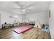 Bright playroom with hardwood floors, gymnastics equipment, and ample space for children at 2700 Dorado Ct, Apopka, FL 32703