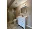 Bathroom with shower and vanity at 2700 Hoover Dr, Deltona, FL 32738