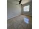 Bright bedroom with tile floors and ceiling fan at 2700 Hoover Dr, Deltona, FL 32738