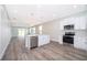 Modern kitchen featuring white shaker cabinets, stainless steel appliances, and a large island at 2712 Alamo Dr, Orlando, FL 32805