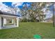 Spacious backyard with grassy lawn and covered patio at 2909 S Palmetto Ave, Sanford, FL 32773