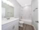 Clean bathroom, featuring a white vanity, shower, and bathtub at 2909 S Palmetto Ave, Sanford, FL 32773