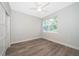 Well-lit bedroom with wood-look flooring and a ceiling fan at 2909 S Palmetto Ave, Sanford, FL 32773