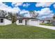 Modern, single-story home with white exterior and attached garage at 2909 S Palmetto Ave, Sanford, FL 32773