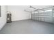 Garage with automatic door opener and gray epoxy floor at 2909 S Palmetto Ave, Sanford, FL 32773