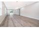 Bright and airy living room with wood-look floors and sliding glass doors at 2909 S Palmetto Ave, Sanford, FL 32773