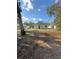 View of the home's backyard, showing cleared land at 309 Albany Ave, Deland, FL 32724