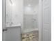 Modern bathroom with a shower, toilet, and white vanity at 309 Albany Ave, Deland, FL 32724