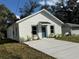 Newly constructed home with a teal door and small front yard at 309 Albany Ave, Deland, FL 32724