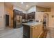 Kitchen with granite countertops and dark wood cabinets at 3202 Alling, Deltona, FL 32725