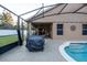 Screened pool with a patio and covered grill area at 3202 Alling, Deltona, FL 32725