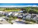 Aerial view of homes near a golf course and lake at 3465 Middlebrook Pl, Harmony, FL 34773