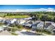 Aerial view of homes overlooking a golf course and lake at 3465 Middlebrook Pl, Harmony, FL 34773