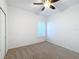 Bright bedroom with ceiling fan and neutral carpeting at 3465 Middlebrook Pl, Harmony, FL 34773