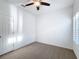 Bright bedroom with ceiling fan and neutral carpeting at 3465 Middlebrook Pl, Harmony, FL 34773