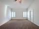 Large bedroom with high ceilings, carpet, and two closets at 3465 Middlebrook Pl, Harmony, FL 34773