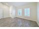 Empty common area with neutral-toned tile flooring and white walls at 3465 Middlebrook Pl, Harmony, FL 34773