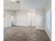 Empty common area with neutral-toned tile flooring and white walls at 3465 Middlebrook Pl, Harmony, FL 34773