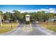 Community entrance with signage and landscaping at 3465 Middlebrook Pl, Harmony, FL 34773