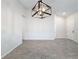 Spacious dining area with tile floors, neutral walls, and a modern chandelier at 3465 Middlebrook Pl, Harmony, FL 34773