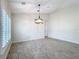 Spacious dining area with tile floors, neutral walls, and a modern chandelier at 3465 Middlebrook Pl, Harmony, FL 34773