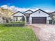 Two-story house with a brick paved walkway, a two-car garage, and well-manicured lawn at 3465 Middlebrook Pl, Harmony, FL 34773