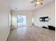 Gathering room with pool access, tile floors and built-in entertainment at 3465 Middlebrook Pl, Harmony, FL 34773