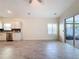 Open Gathering room and kitchen area with tile floors at 3465 Middlebrook Pl, Harmony, FL 34773