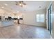 Open Gathering room with tile floors and views into the kitchen at 3465 Middlebrook Pl, Harmony, FL 34773