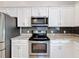 Well-equipped kitchen with stainless steel appliances and granite countertops at 3465 Middlebrook Pl, Harmony, FL 34773