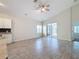 Spacious living area with tile flooring and access to the backyard at 3465 Middlebrook Pl, Harmony, FL 34773