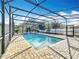 Inviting swimming pool with screened enclosure at 3465 Middlebrook Pl, Harmony, FL 34773