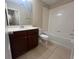 Bathroom with tub, vanity, and toilet at 3656 Brighton Park Cir, Orlando, FL 32812