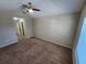 Spacious bedroom with carpeted floors and ceiling fan at 3656 Brighton Park Cir, Orlando, FL 32812