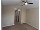 Spacious Primary bedroom with ceiling fan and walk-in closet at 3656 Brighton Park Cir, Orlando, FL 32812