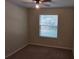 Bright bedroom with carpeted floors and window blinds at 3656 Brighton Park Cir, Orlando, FL 32812