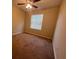 Well-lit bedroom with carpeted floors and window coverings at 3656 Brighton Park Cir, Orlando, FL 32812