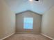 Bright bedroom with vaulted ceiling and window at 3656 Brighton Park Cir, Orlando, FL 32812