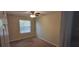 Bright bedroom featuring a ceiling fan and window at 3656 Brighton Park Cir, Orlando, FL 32812