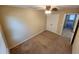 Spacious bedroom with neutral carpeting and double doors leading to the closet at 3656 Brighton Park Cir, Orlando, FL 32812