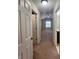 Hallway leading to bedroom with window and bathroom access at 3656 Brighton Park Cir, Orlando, FL 32812