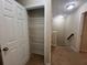 Hallway with linen closet and stairs at 3656 Brighton Park Cir, Orlando, FL 32812