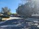 Community parking lot with several cars at 3656 Brighton Park Cir, Orlando, FL 32812