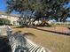 Community playground under a large tree at 3656 Brighton Park Cir, Orlando, FL 32812